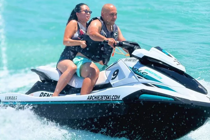 Jet ski waiting on the sand at Isla Verde beach for a 45-minute jet ski rental in Puerto Rico